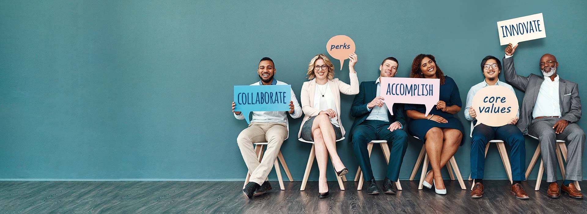 Co-workers sharing their successful strategies with signs